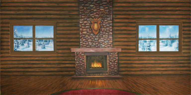 Cozy log cabin living room with a stone fireplace, deer head mount, and snow-covered windows on either side.