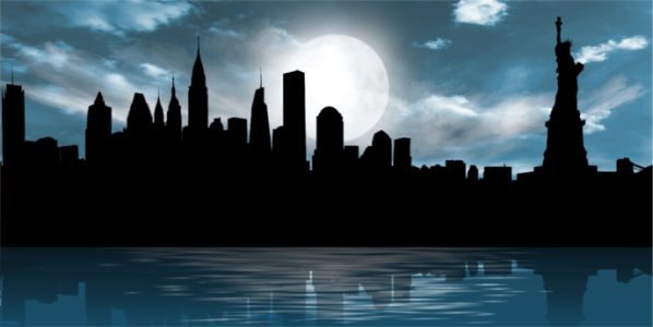Silhouette of a city skyline at night with a full moon and cloudy sky, reflected on calm water.