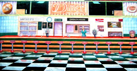 Retro diner mural with a long counter, red stools, and a large 'Diner' sign above; open 24 hours mentioned.