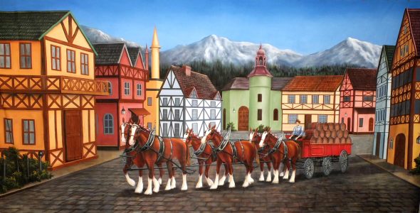 Colorful town square with a horse-drawn carriage and row of timber-framed buildings, mountains in the background.