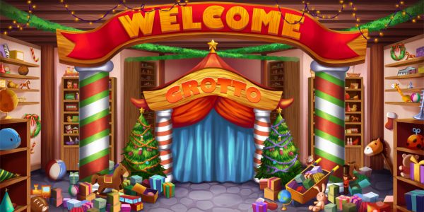 Colorful toy shop decorated for Christmas, with a stage labeled 'Grotto' under a 'Welcome' banner and piled gifts on the floor.